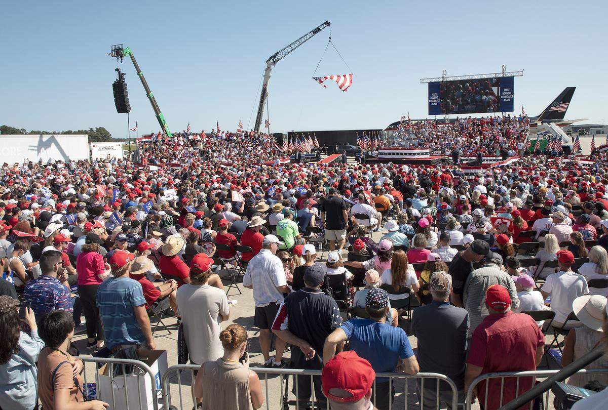 A crowd listens to remarks by former President and current Republican candidate for president Donald Trump in Wilmington, N.C. on Saturday, Sept. 21, 2024.