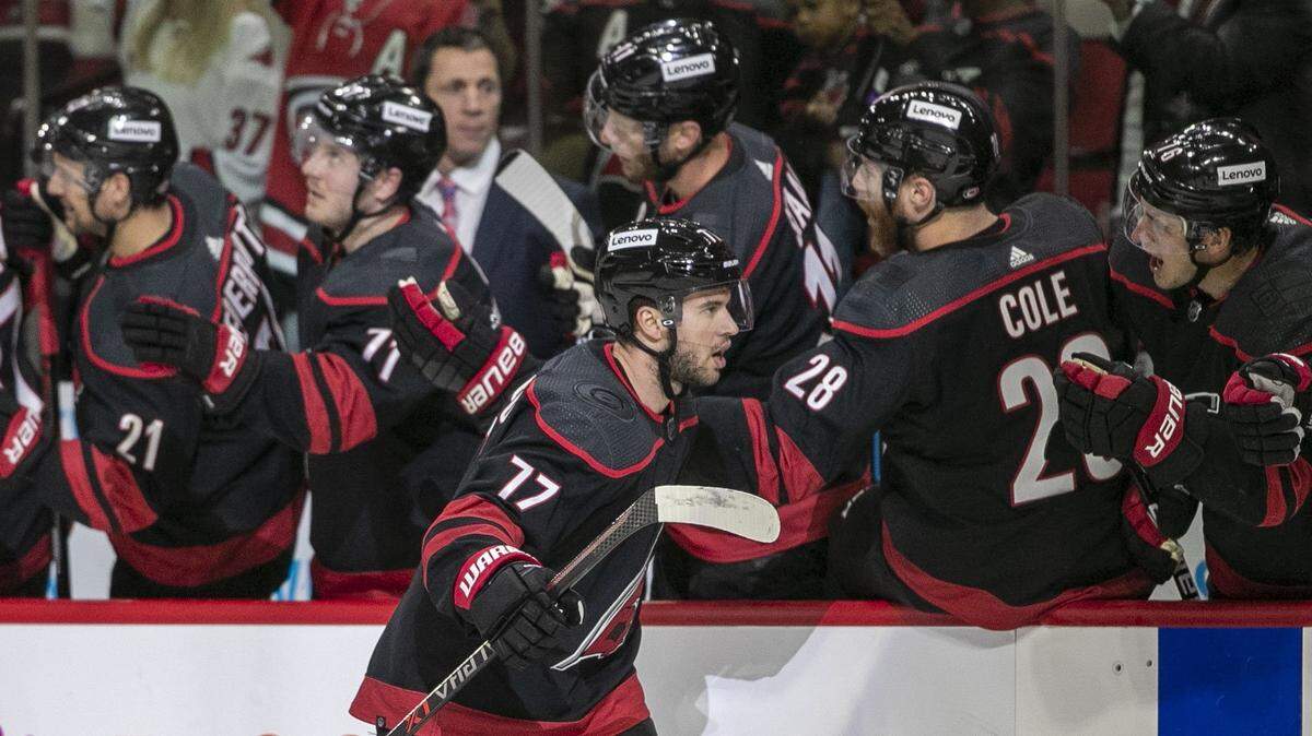 Carolina Hurricanes Tony DeAngelo (77) reacts as he skates to the bench after scoring a goal in the first period to give the Hurricanes a 2-0 lead over Boston on Tuesday, May 10, 2022 during game five of their Stanley Cup first round series at PNC Arena in Raleigh, N.C.
