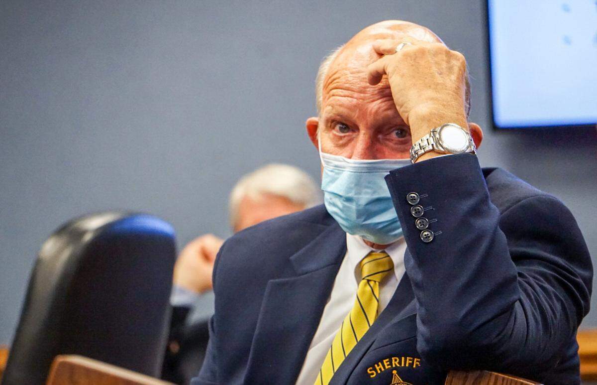Sheriff Terry Johnson sits in a county commissioners meeting on July 20, 2020.
