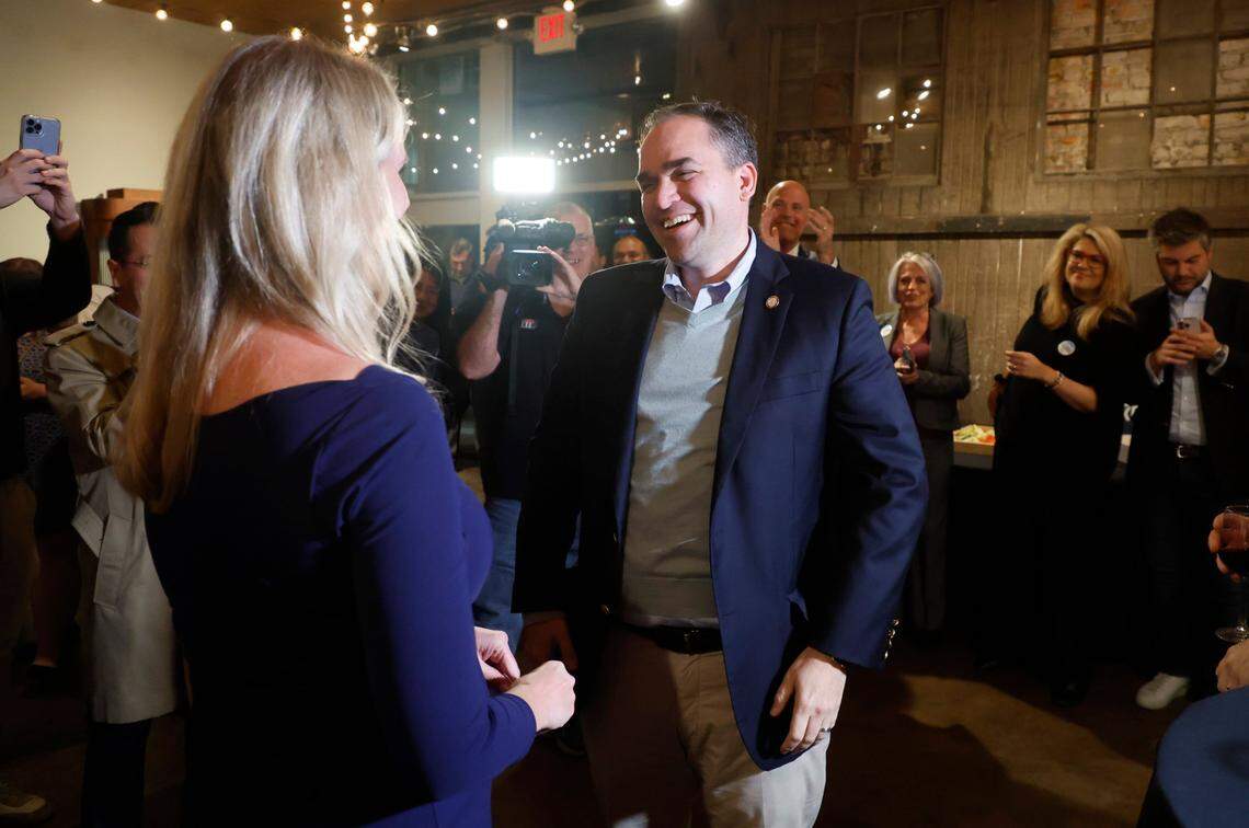 Wiley Nickel laughs with his wife, Caroline, as he greets supporters at a campaign party at Sitti in Raleigh, N.C., Tuesday, Nov. 8, 2022.