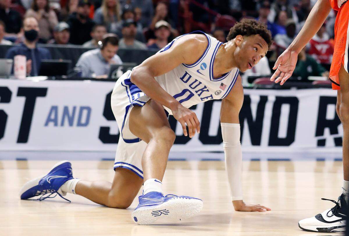 Duke’s Wendell Moore Jr. (0) gets up after slipping on the floor twice during the first half of Duke’s game against Cal State Fullerton in the first round of the NCAA Tournament at Bon Secours Wellness Arena in Greenville, S.C., Friday, March 18, 2022.