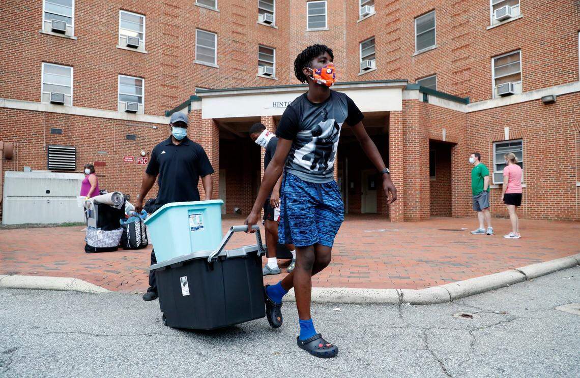 Chauncey Sumpter Jr. helps move his sister, Charisma Sumpter, a freshman at UNC-Chapel Hill from Raleigh, from her room at Hinton James residence hall in Chapel Hill, N.C., Tuesday, August 18, 2020.