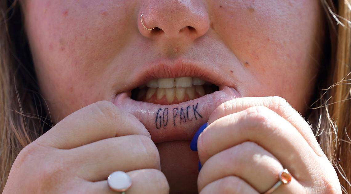 N.C. State sophomore Tyra Jones tattooed Go Pack on her inside lip. She is seen before N.C. State’s game against VMI at Carter-Finley Stadium in Raleigh, N.C., Saturday, Sept. 16, 2023.