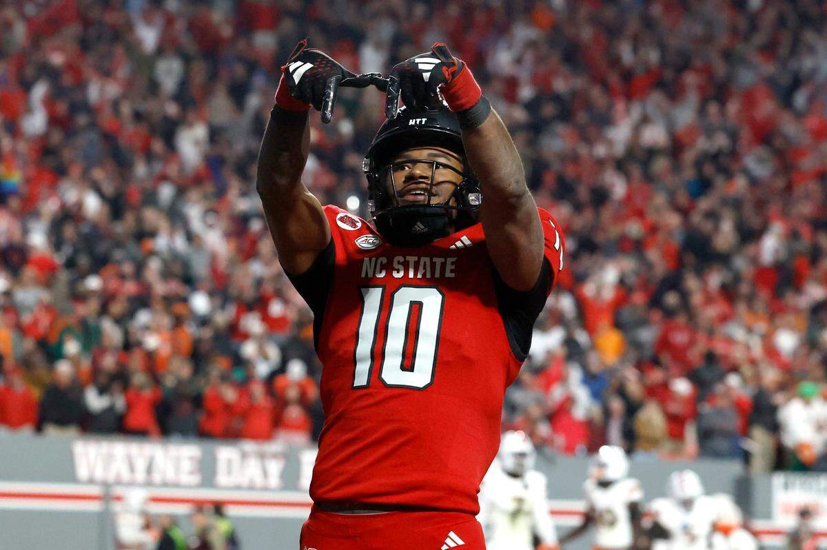 N.C. State wide receiver KC Concepcion (10) celebrates after Kendrick Raphael scored on a 31-yard touchdown run during the Wolfpack’s 20-6 victory over Miami at Carter-Finley Stadium in Raleigh, N.C., Saturday, Nov. 4, 2023.