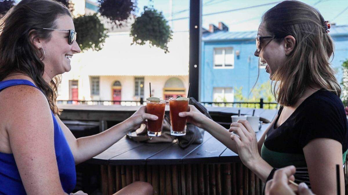 Sister-in-laws, Maggie Lloyd, left, and Charlotte Lloyd toast a pair of Bloody Mary’s at Humble Pie in Raleigh Sunday, July 9, 2017.