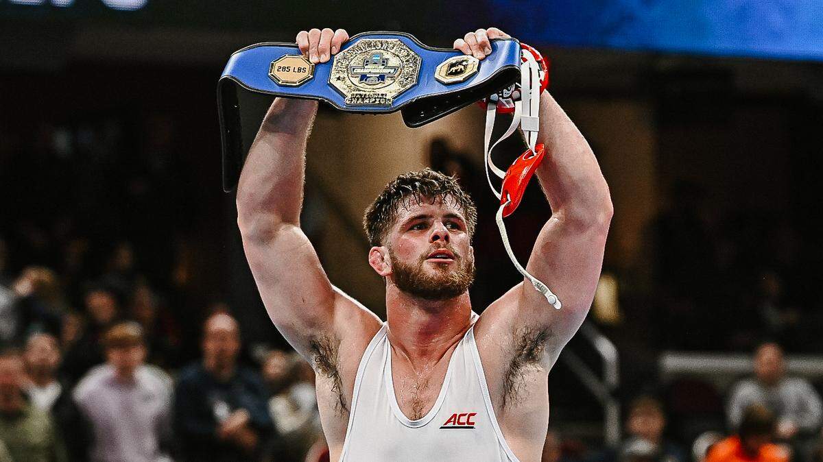 N.C. State wrestler Isaac Trumble celebrates after winning the NCAA national championship in the heavyweight class on March 21, 2026, in Cleveland, Ohio.