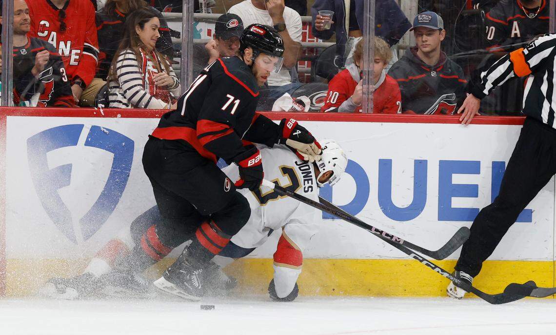 Carolina’s Taylor Hall (71) keeps his eyes on the puck as Panthers’ Seth Jones (3) hits the boards during the first period of the Carolina Hurricanes’ game against the Florida Panthers in Game 2 of the Eastern Conference Final at the Lenovo Center in Raleigh, N.C., Thursday, May 22, 2025.