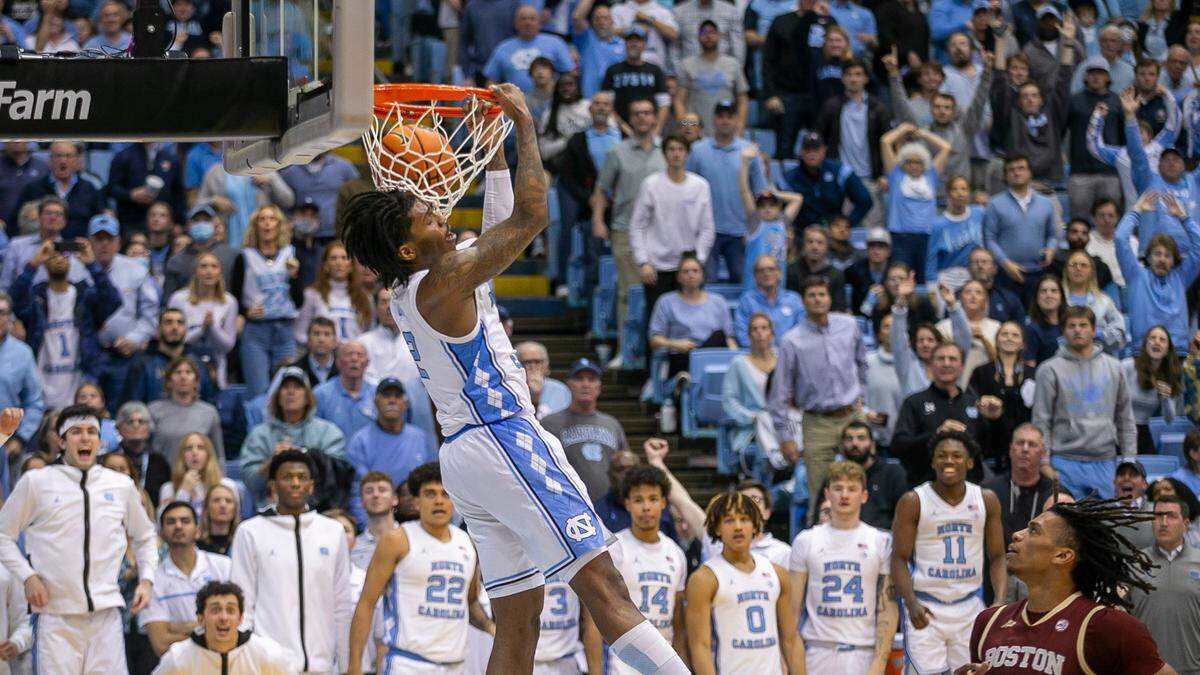 North Carolina’s Caleb Love (2) scores on a reverse dunk ahead of Boston College’s DeMarr Langford Jr. (5) to give the Tar Heels a 72-62 lead during the second half on Tuesday, January 17, 2023 at the Smith Center in Chapel Hill, N.C.