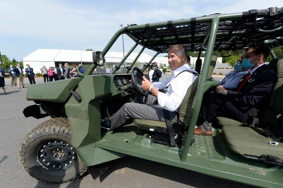 U.S. Senator Thom Tillis of North Carolina takes a test drive a new Infantry Squad Vehicle built for the U.S. Army at the GM Defense facility in Concord, NC, during a tour in May 2021. The vehicle is an air-transportable high-speed, light utility vehicle based on the Chevrolet Colorado ZR2 platform.