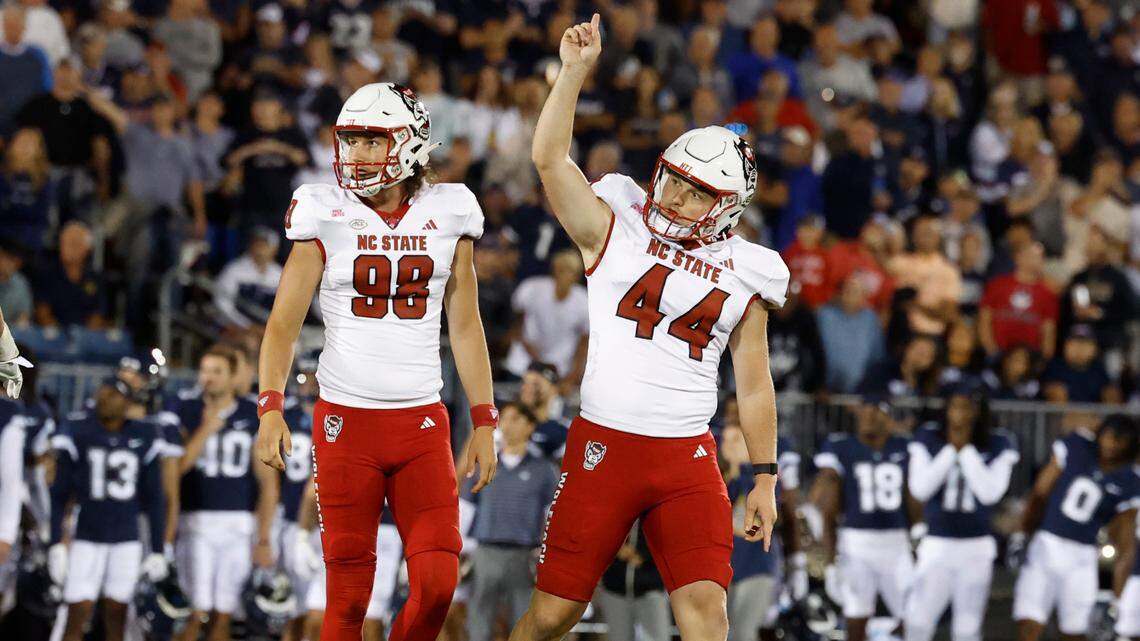 N.C. State’s Brayden Narveson (44) celebrates after hitting a 44-yard field goal during the first half of the Wolfpack’s game against UConn at Rentschler Field in East Hartford, Conn. Thursday, August 31, 2023. N.C. State’s Caden Noonkester (98), who is the holder, stands to the left.