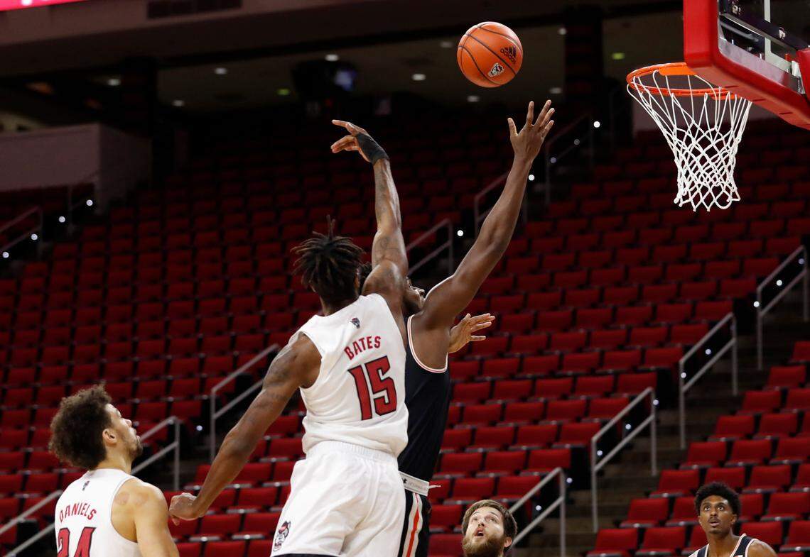 N.C. State’s Manny Bates (15) blocks the shot by Campbell’s Joshua Lusane (23) during the first half of N.C. State’s game against Campbell at PNC Arena in Raleigh, N.C., Saturday, Dec. 19, 2020.