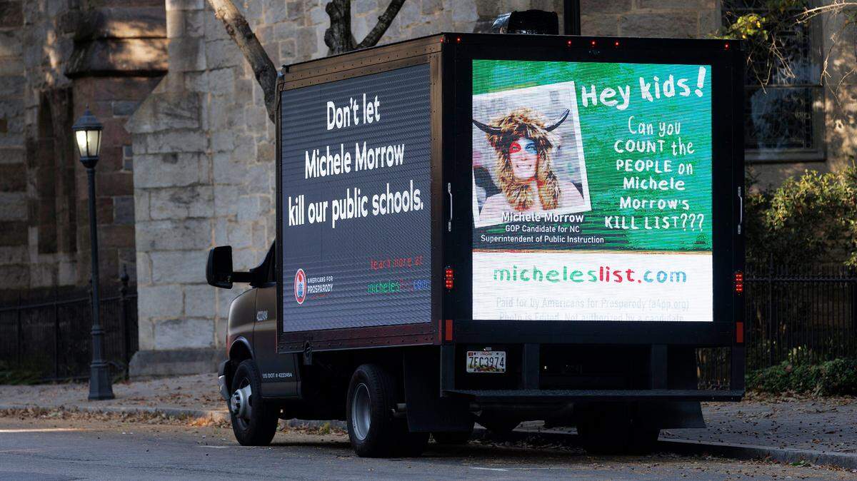 A vehicle displays a digital message about Michele Morrow, Republican candidate for North Carolina superintendent of public instruction, in downtown Raleigh, N.C. on Thursday, Oct. 24, 2024.
