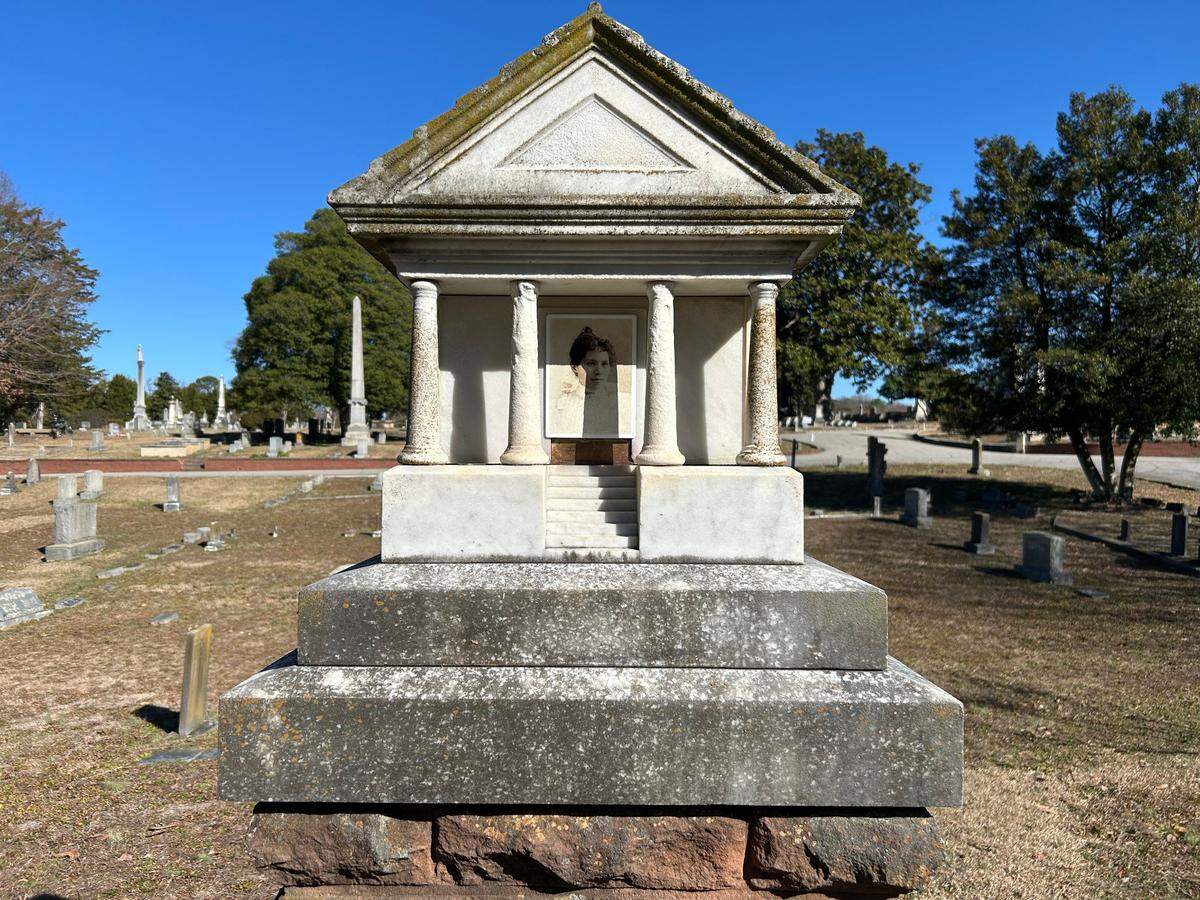 A.G. Bauer burned the image of his wife Rachel’s face onto a piece of porcelain for her grave at Oakwood Cemetery. In early years after her death in 1897, visitors in Raleigh believed her ghost would appear.