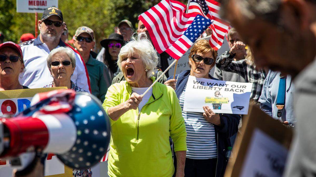 Protesters demonstrate in front of the Executive Mansion during a ReOpen NC rally in downtown Raleigh Tuesday, May 12, 2020.