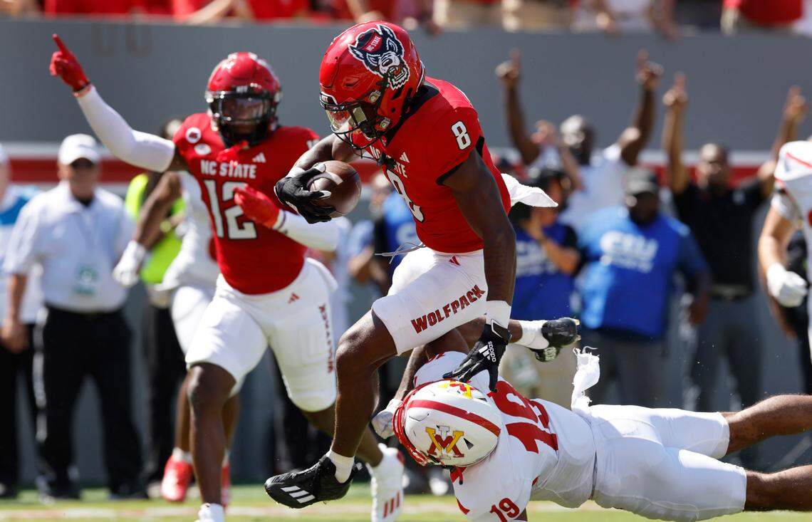 N.C. State defensive back Robert Kennedy (8) beats Virginia Military Institute defensive back Wilson Chandler (19) as he returns an interception for a touchdown during the first half of N.C. State’s game against VMI at Carter-Finley Stadium in Raleigh, N.C., Saturday, Sept. 16, 2023.
