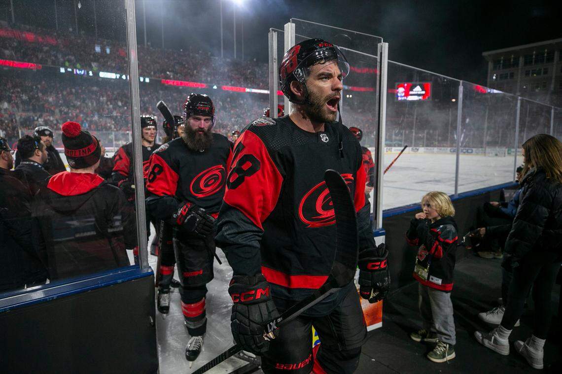 Carolina Hurricanes’ Jordan Martinook (48) acknowledges fans as he leaves the ice following their 4-1 victory over the Washington Capitals in the Stadium Series game on Saturday, February 18, 2022 at Carter-Finley Stadium in Raleigh, N.C.