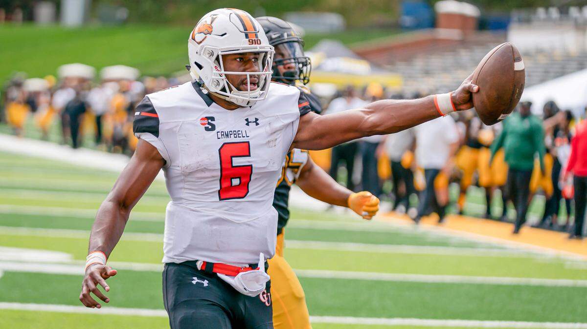 Campbell quarterback Hajj-Malik Williams scores against Appalachian State on Sept. 26 in Boone. The FCS-level Camels are playing a four-game schedule against FBS opponents this season, concluding with Wake Forest on Friday.