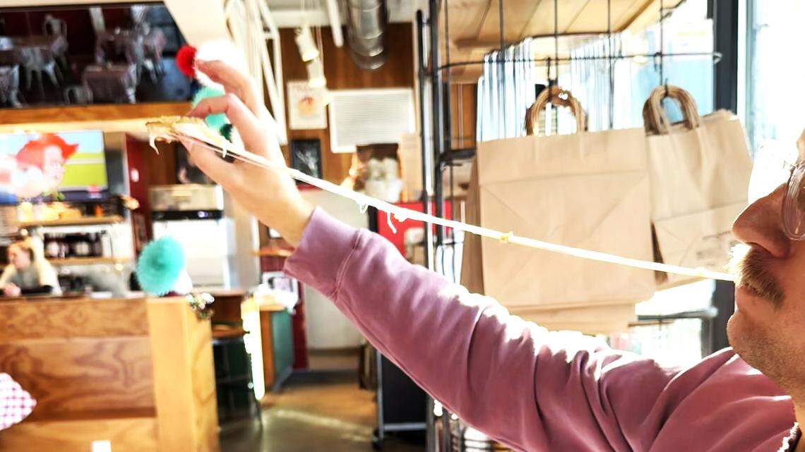 The cheese pulls are strong at Dino’s Pizza in Durham.