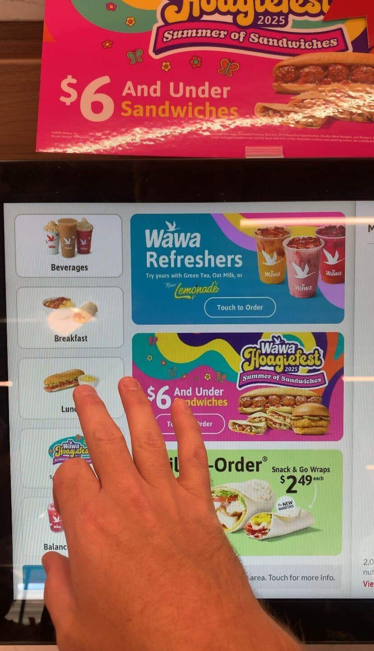 Sandwiches, sides and snacks are all ordered from touch screen kiosks.