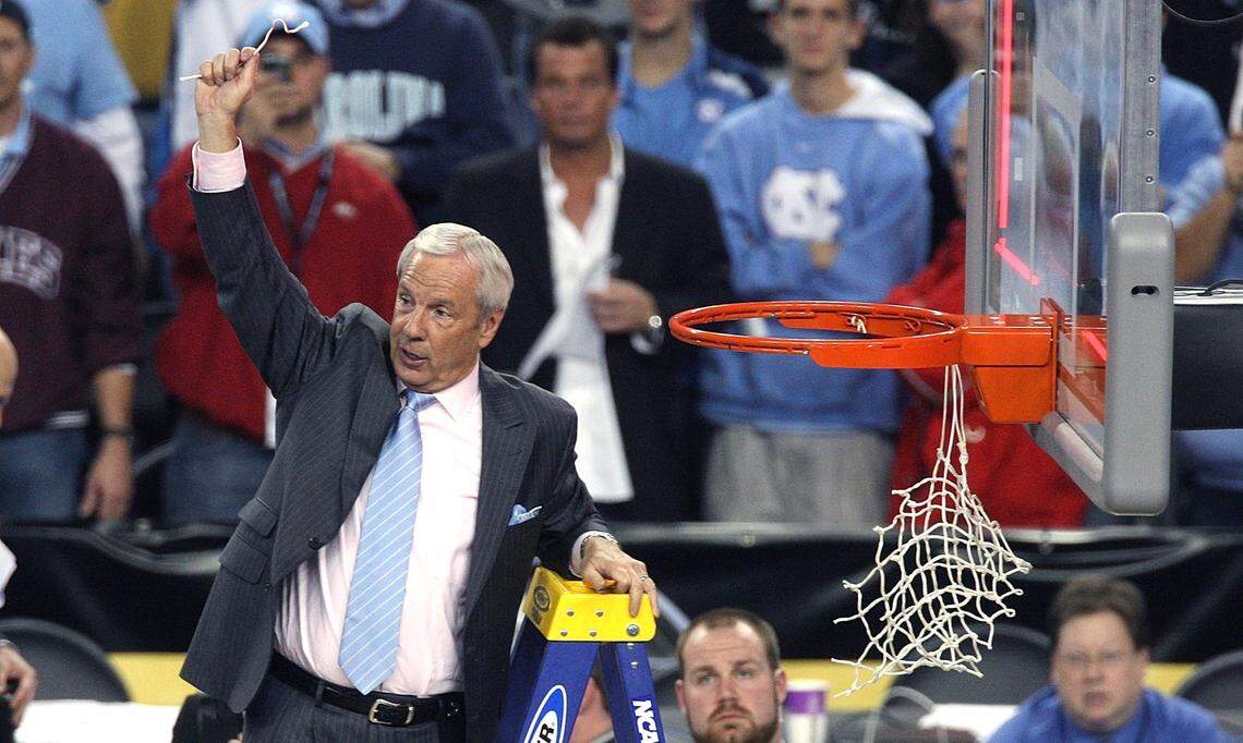 North Carolina head coach Roy Williams cuts down the nets at Ford Field in Detroit, Michigan after winning the national championship Monday April 6, 2009.