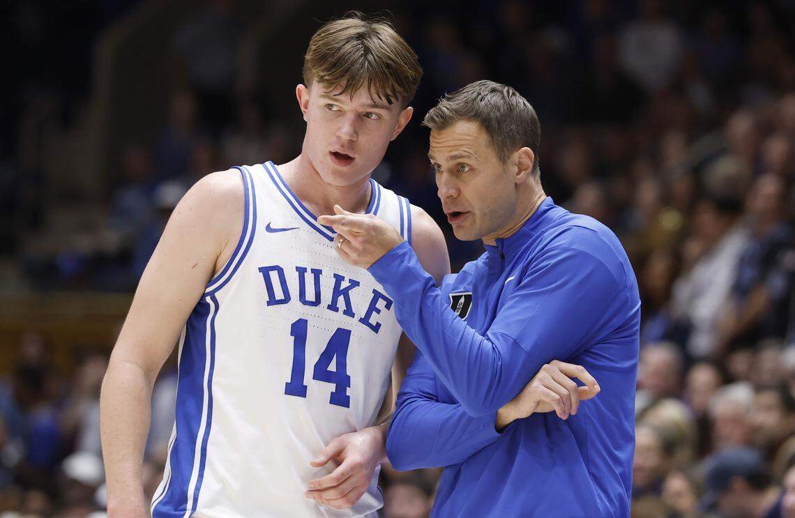 Duke head coach Jon Scheyer talks to Nikolas Khamenia (14) during the second half of Duke’s 100-62 victory over Indiana State at Cameron Indoor Stadium in Durham, N.C., Friday, Nov. 14, 2025.
