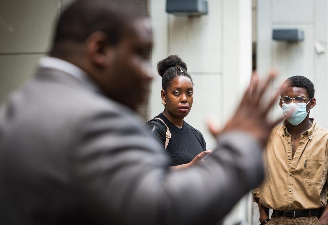 Brienne Neville (center) and Kristopher Brown-Neville (right), daughter and son of John Neville, listen as their brother, Sean Neville, answers questions in an interview after a hearing on the petition to release the jail surveillance and body camera footage in connection to the jail-related death of John Neville on Wednesday, July 29, 2020, at the Forsyth County Hall of Justice in Winston-Salem, N.C. (Allison Lee Isley/Winston-Salem Journal) 20200730w_nws_neville