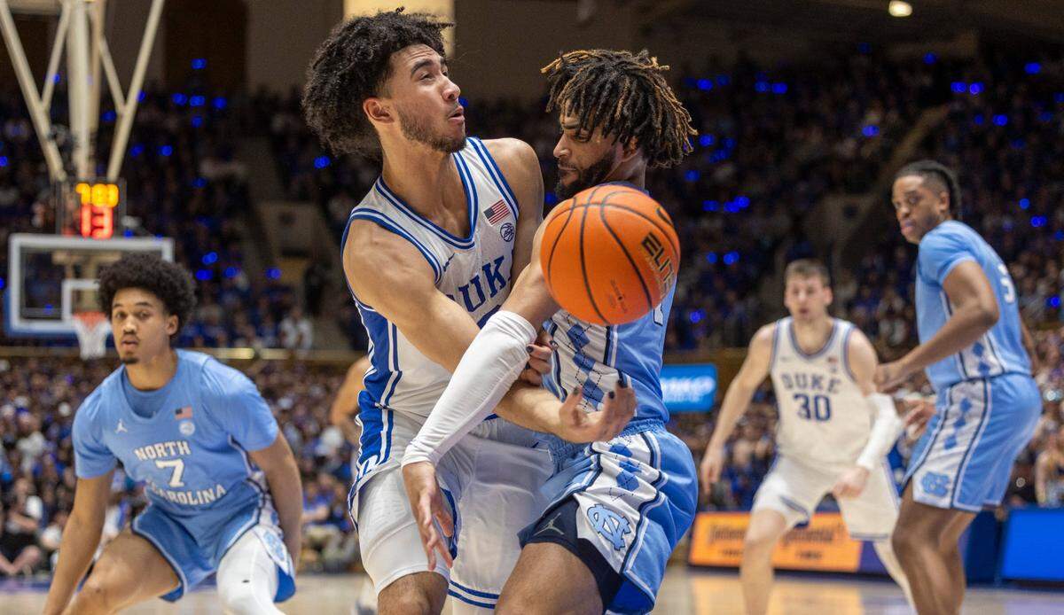 North Carolina’s R.J. Davis (4) defends Duke’s Jared McCain (0) in the first half on Saturday, March 9, 2024 at Cameron Indoor Stadium in Durham, N.C.