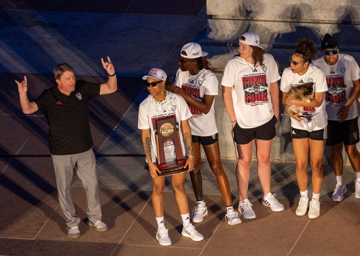 NC State’s women’s basketball players and head coach Wes Moore celebrate their Final Four run at the Memorial Belltower on Monday, April 15, 2024.