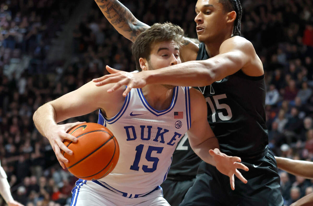 Virginia Tech’s Lynn Kidd (15) defends Duke’s Ryan Young (15) during the first half of Duke’s game against Virginia Tech at Cassell Coliseum in Blacksburg, VA., Monday, Jan. 23, 2023.