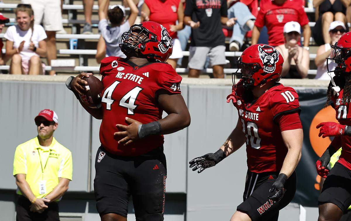 N.C. State defensive tackle Brandon Cleveland (44) celebrates recovering a Northern Illinois fumble during the second half of N.C. State’s 24-17 victory over Northern Illinois at Carter-Finley Stadium in Raleigh, N.C., Saturday, Sept. 28, 2024.
