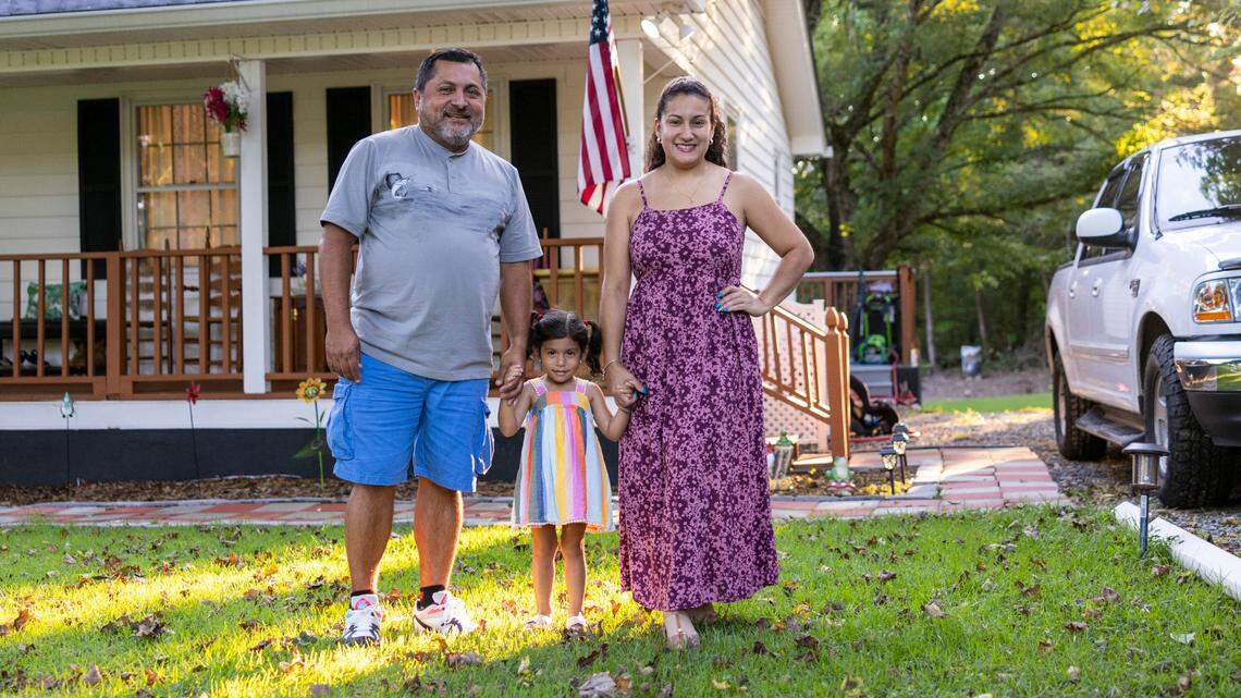 Carlos Bajana and his wife Andrea Bajana with their 4-year-old daughter Cassandra Bajana at their home in Henderson. The rate of Latino homeowners has steadily risen in the in North Carolina, with homeownership rates increasing in 95 of the state’s 100 counties in the decade ending 2020, census data shows.