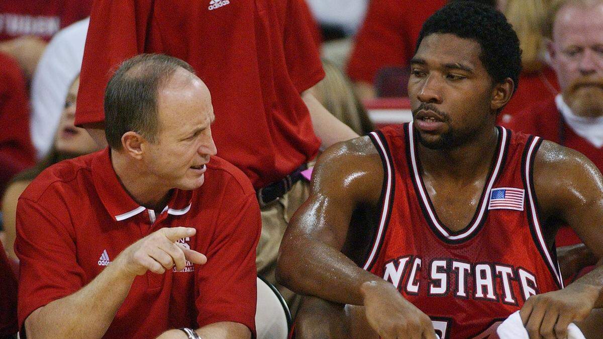 Former N.C. State assistant basketball coach Larry Hunter speaks with Marcus Melvin in 2002. Hunter died Friday from a stroke.