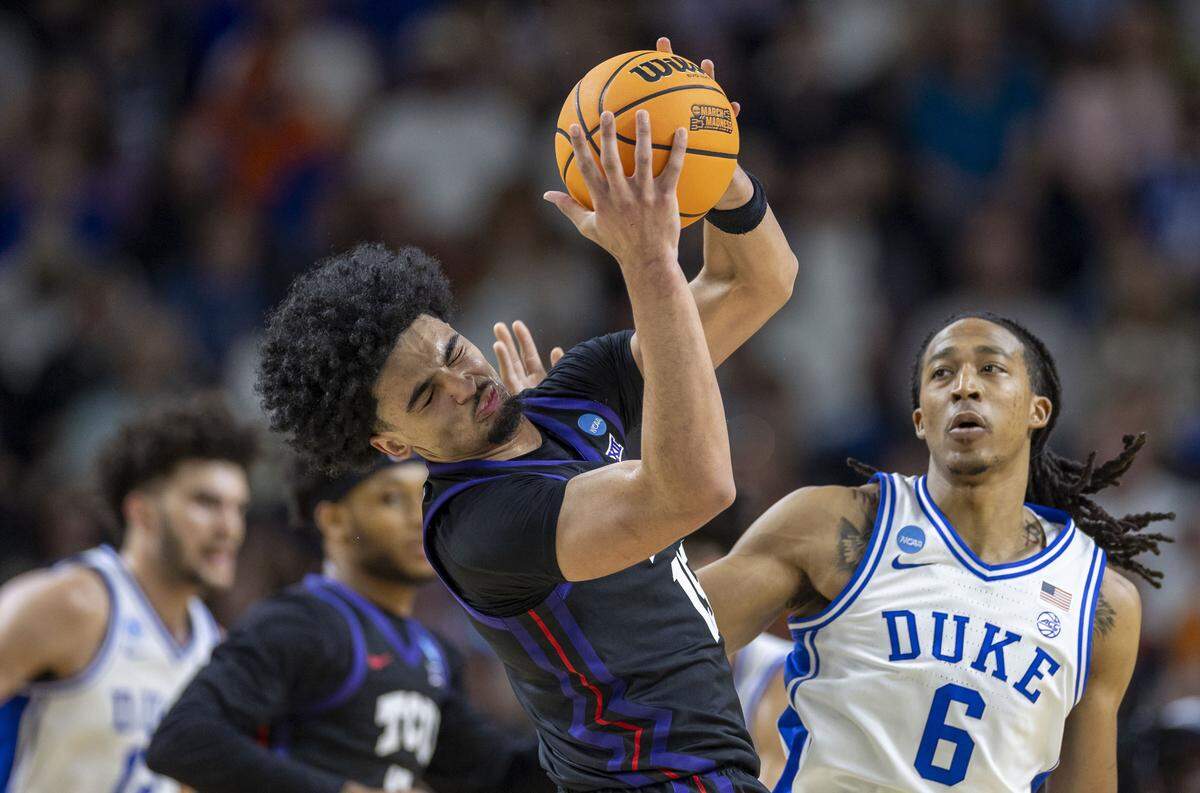 Duke forward Isaiah Evans (3) defends TCU forward David Punch (15) in the first half on Saturday, March 21, 2026, during the second round of the NCAA Tournament at Bon Secours Arena in Greenville, S.C.