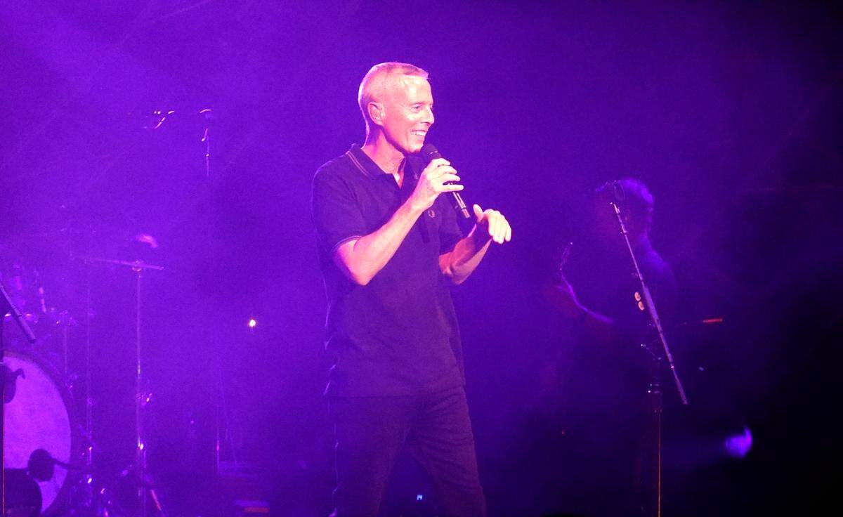 Curt Smith smiles as he sings during the Tears for Fears concert at Coastal Credit Union Music Park in Raleigh, N.C., Saturday, July 8, 2023.