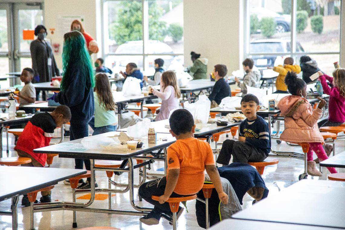Kindergarten students at Green Elementary School, eat lunch in the cafeteria Monday, March 15, 2021 at the Raleigh school.