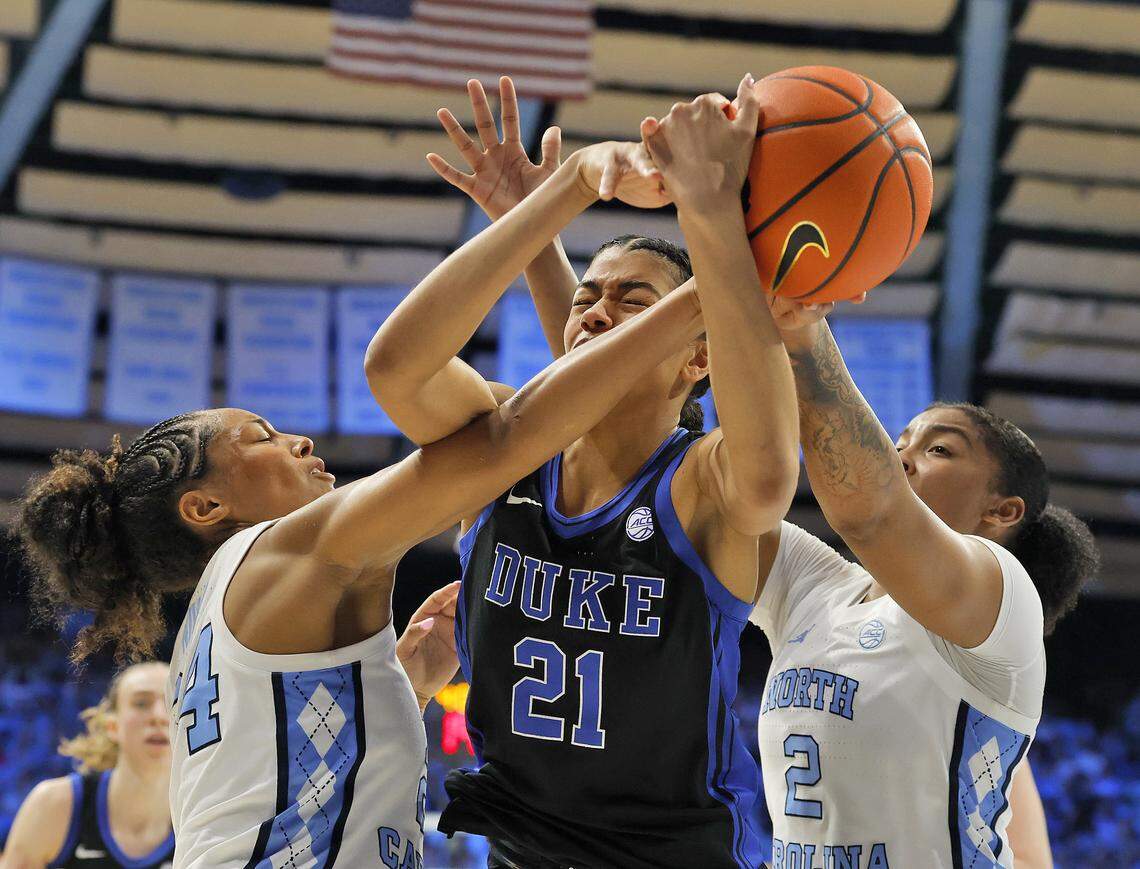 North Carolina’s Indya Nivar and Nyla Harris pressure Duke’s Arianna Roberson during the second half of the Tar Heels’ 74-69 win on Sunday, March 1, 2026, at Carmichael Arena in Chapel Hill, N.C. 