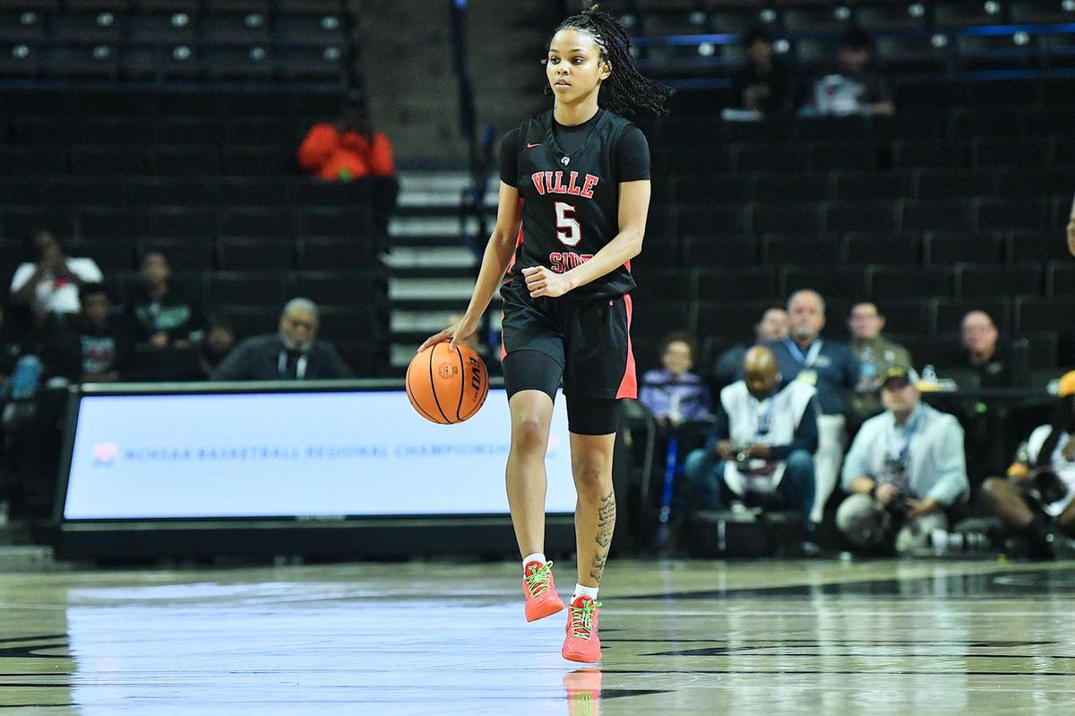 Rolesville’s Caitlyn Jones (5) brings the ball down court to set up offense against Hoggard during the 4a East Regional Finals. Rolesville and Hoggard met in the NCHSAA 4A East Regional Championship game in Winston-Salem, N.C. on March 14, 2024.