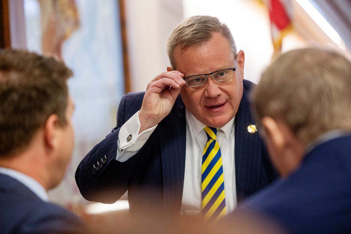 House Speaker Tim Moore, center, confers with his chief of staff, Neal Inman, left, and Rep. Destin Hall, a Caldwell and Watauga County Republican, Thursday, Sept. 21, 2023, prior to the first of several votes on the budget at the General Assembly.