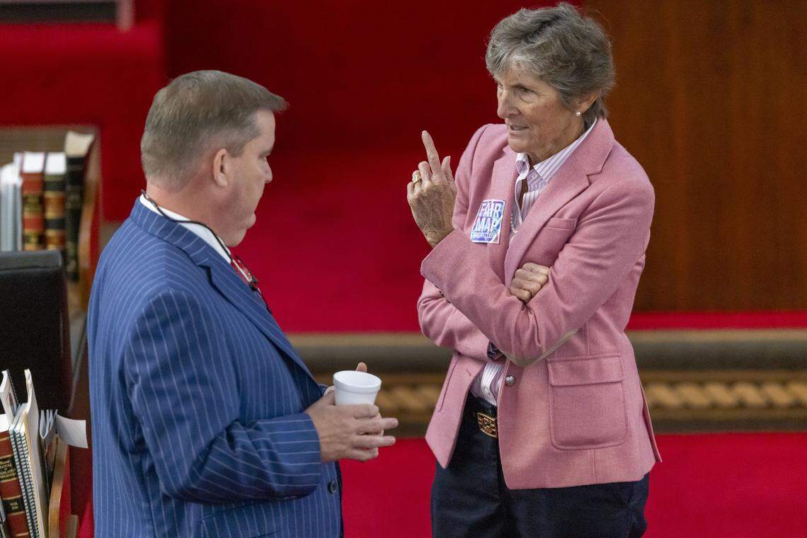 Rep. Pricey Harrison talks with Rep. Brenden H. Jones prior to the House session on Wednesday, October 22, 2025 at the General Assembly in Raleigh, N.C.