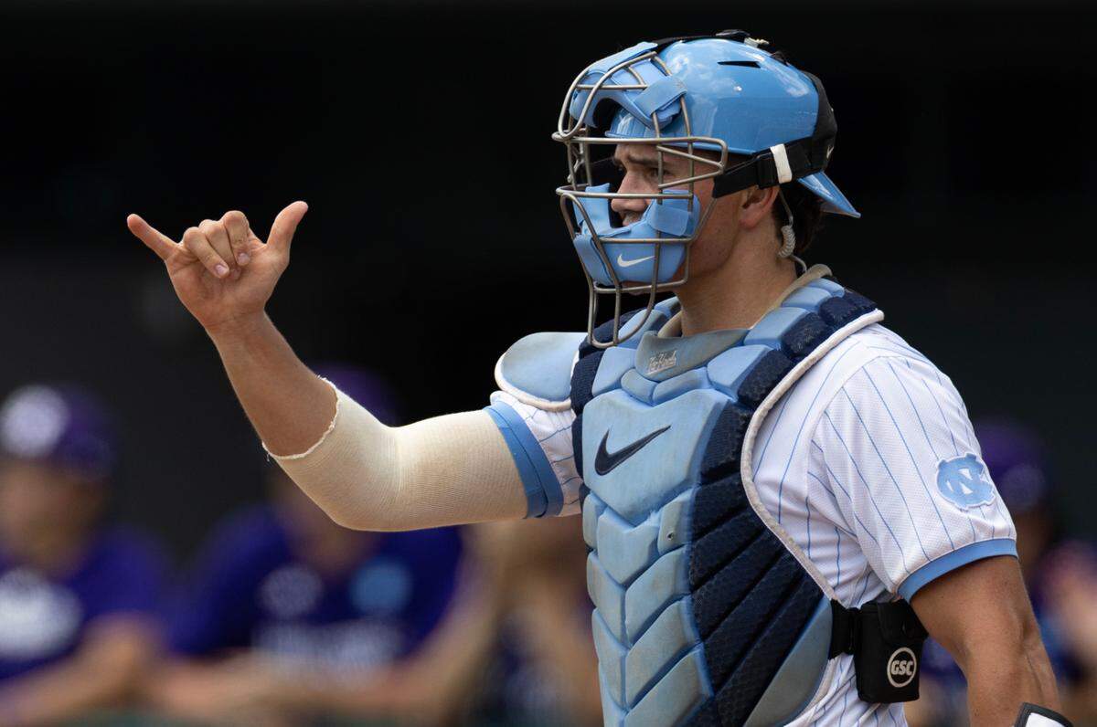 North Carolina’s Luke Stevenson (44) signals to North Carolina’s Jake Knapp during the game against Holy Cross at Boshamer Stadium in Chapel Hill on Friday, May 30, 2025. UNC won with a score of 4-0.
