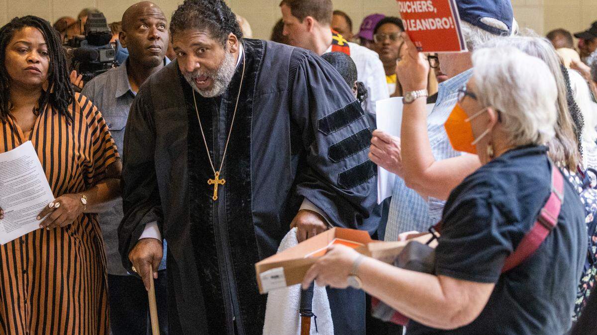 The Rev. William Barber II leads a rally of more than 100 demonstrators between entrances to the House and Senate chambers at the Legislative Building in Raleigh on May 24, 2023. Barber is founder and president of Repairers of the Breach, a non-profit social justice and anti-poverty advocacy group.