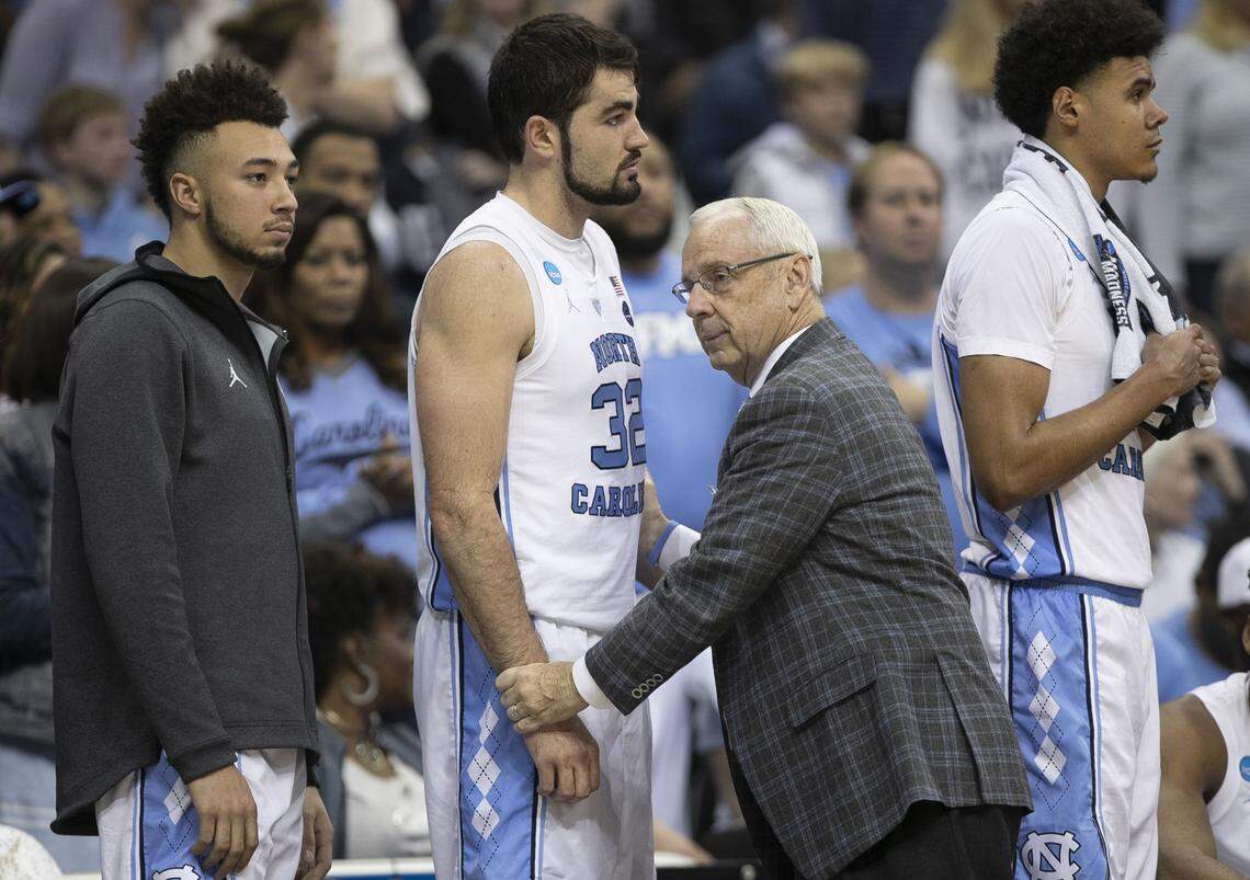 North Carolina coach Roy Williams embraces Luke Maye (32) after taking the seniors out of the game during the final minutes of play as Auburn rolled to a 97-80 victory on Friday, March 29, 2019 at the Sprint Center in Kansas City, Missouri