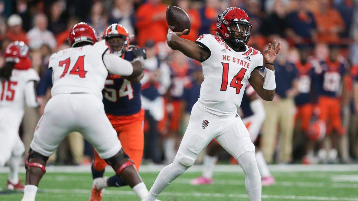 North Carolina State quarterback Jack Chambers (14) throws a pass during the first half of an NCAA college football game against Syracuse on Saturday, Oct. 15, 2022, in Syracuse, N.Y. (AP Photo/Joshua Bessex)