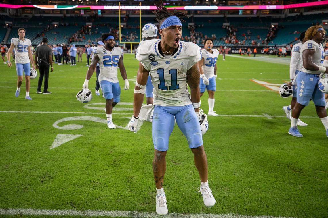 North Carolina wide receiver Josh Downs (11) reacts as he leaves the field with his teammate following their 27-24 victory over Miami on Saturday, October 8, 2022 at Hard Rock Stadium in Miami Gardens, Florida.