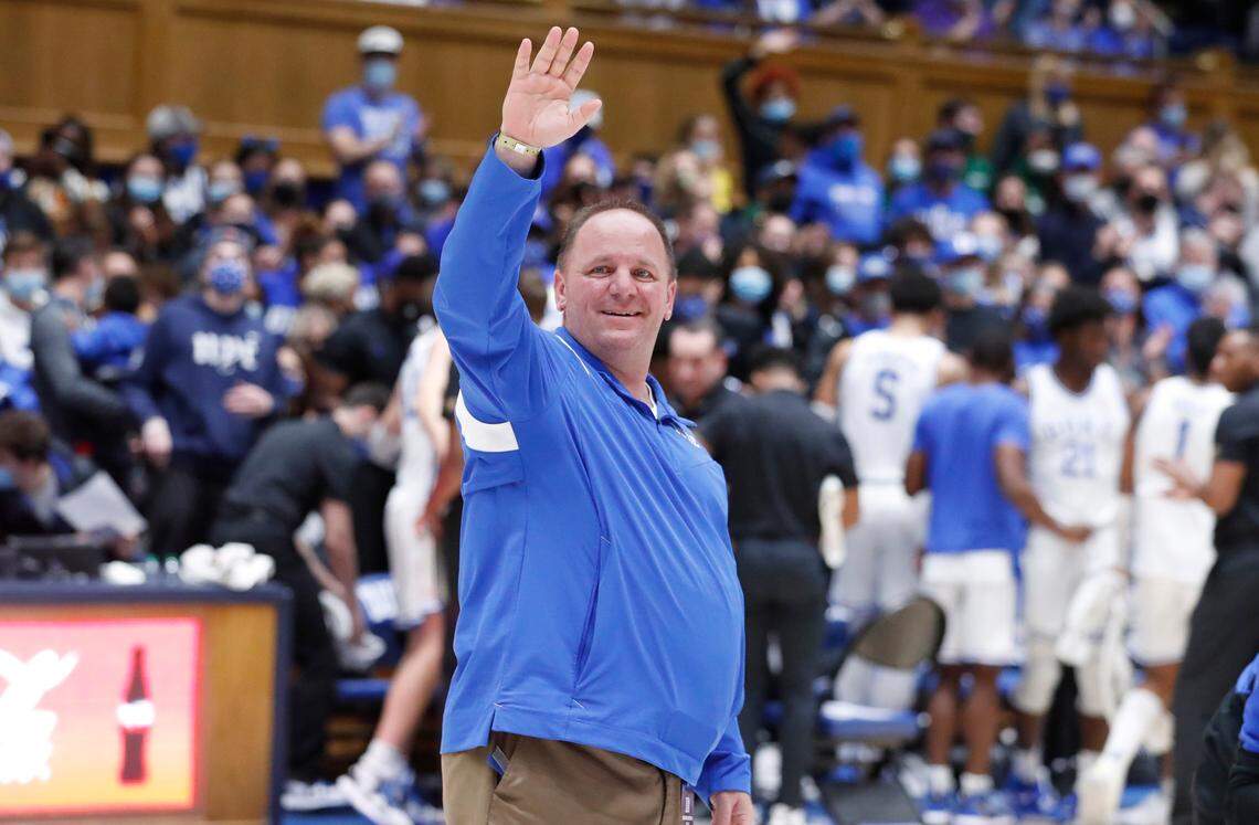New Duke football coach Mike Elko acknowledges the crowd as he is introduced during Duke basketball game against S.C. State at Cameron Indoor Stadium in Durham, N.C., Tuesday, December 14, 2021.
