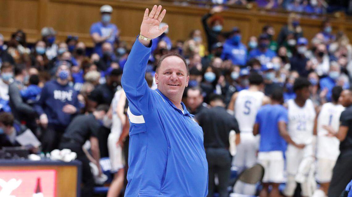 New Duke football coach Mike Elko acknowledges the crowd as he is introduced during Duke basketball game against S.C. State at Cameron Indoor Stadium in Durham, N.C., Tuesday, December 14, 2021.