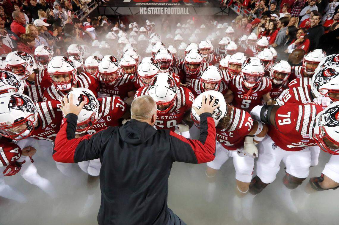 N.C. State head coach Dave Doeren prepares to lead his team out onto the field before N.C. States game against Louisville at Carter-Finley Stadium in Raleigh, N.C., Saturday, October 30, 2021.