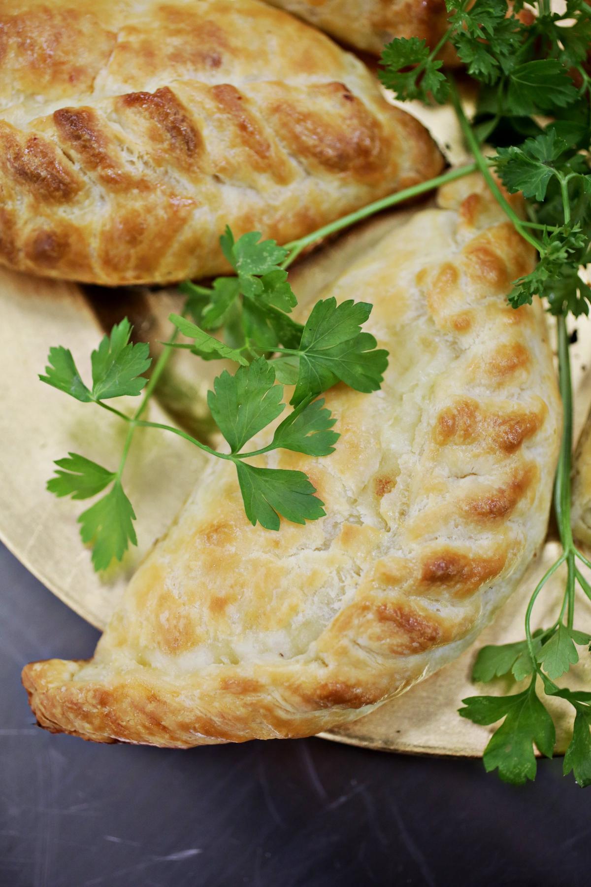 Chicken pastries are a traditional Lithuanian pastry filled with chicken and onion from Baltic Bites food truck.