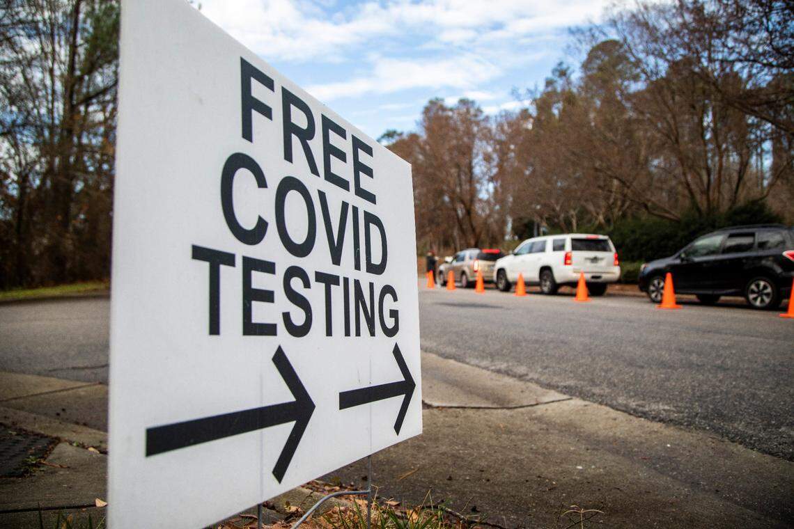 Vehicles line Kidd Road at a COVID-19 testing site in Raleigh Wednesday morning Dec. 22, 2021.