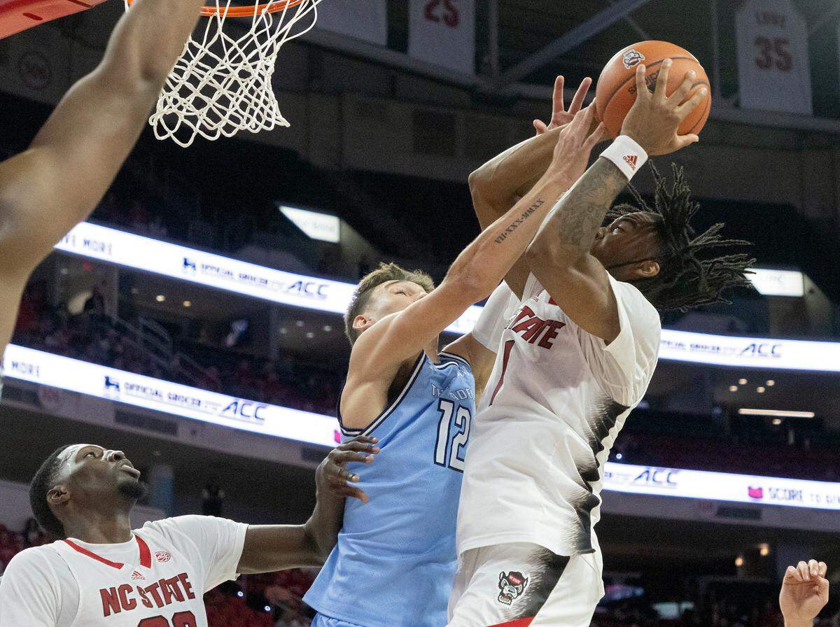 N.C. State’s Jayden Taylor is fouled by the Citadel’s Colby McAllister during the second half of the Wolfpack’s 72-59 win on Monday, Nov. 6, 2023, at PNC Arena in Raleigh, N.C.